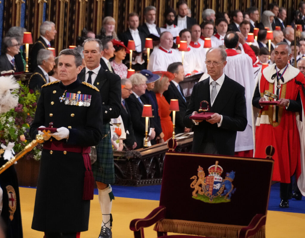 Lord Hastings, alongside the Earl of Loudoun, carries one of the spurs in Procession