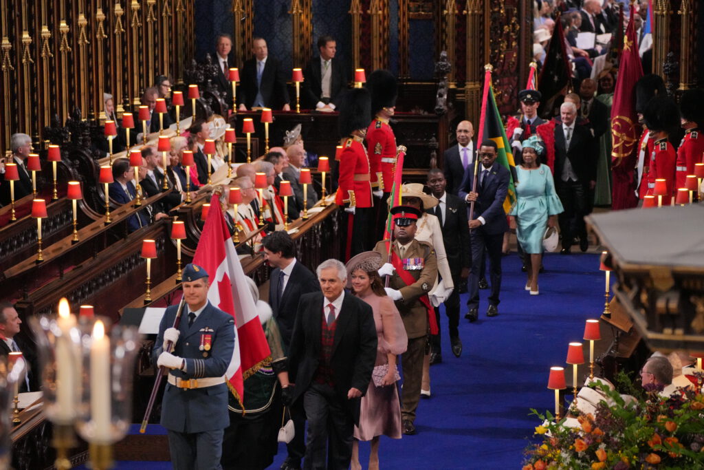 The procession of Realm representatives making its way through the Abbey