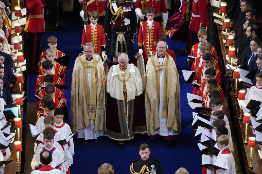 King Charles III arrives for his coronation at Westminster Abbey wearing the Robe of State