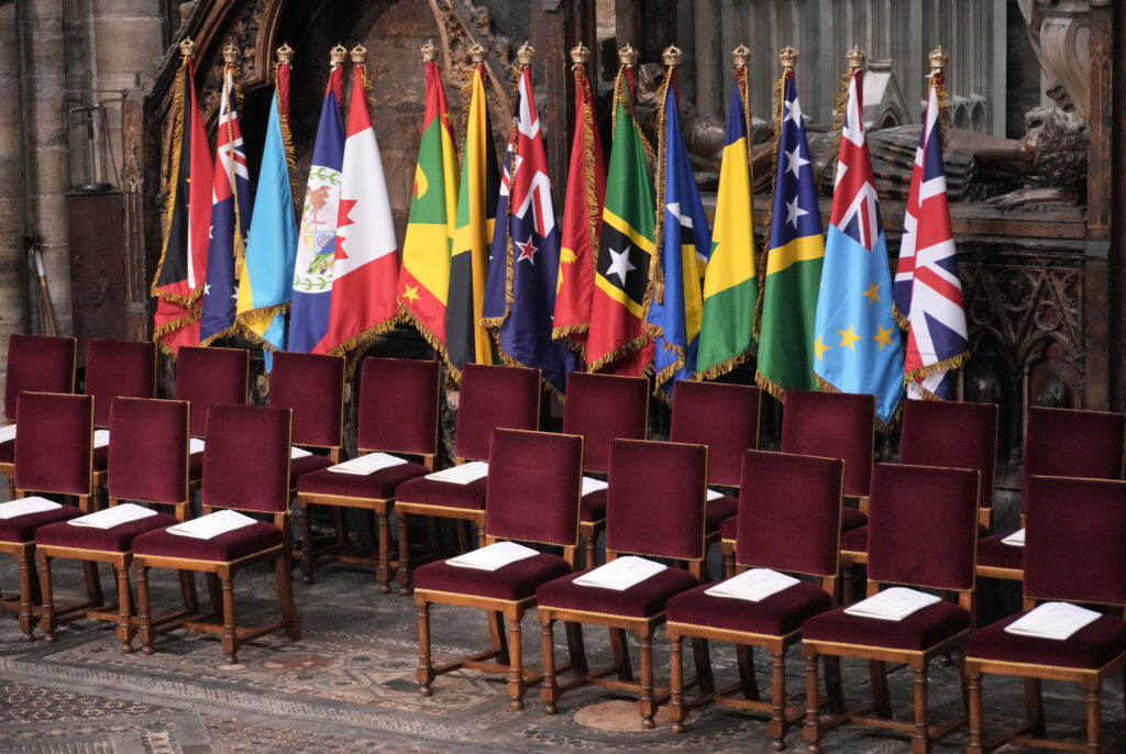 Flags of His Majesty's Realms, positioned on the Sacrarium of Westminster Abbey for the Coronation