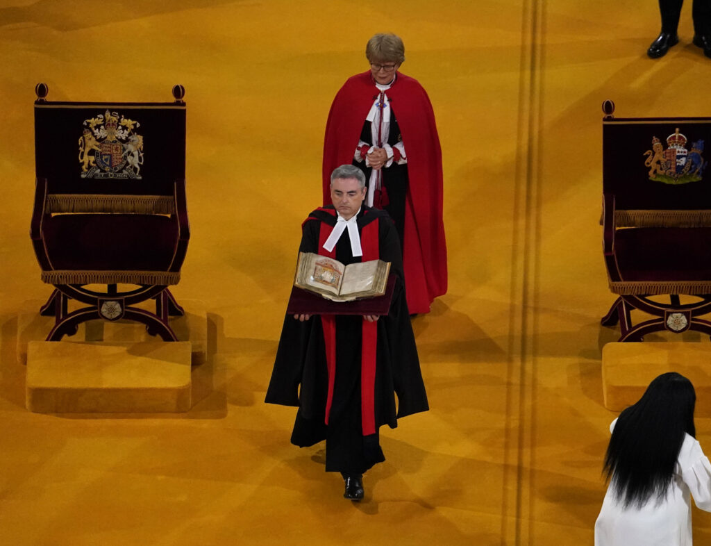 The sixth-century Augustine Gospels are carried by the Master of Corpus Christi College Cambridge during the Coronation of King Charles III and Queen Camilla at Westminster Abbey, London